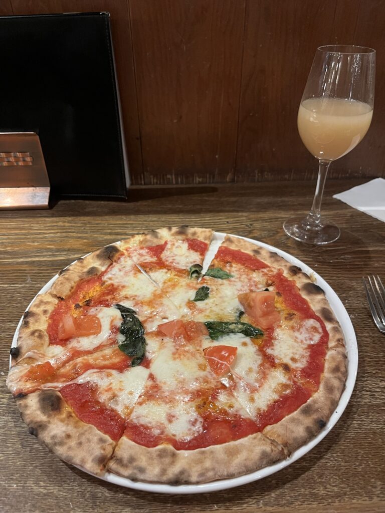 Orrizonte Peach Juice and Margherita Pizza