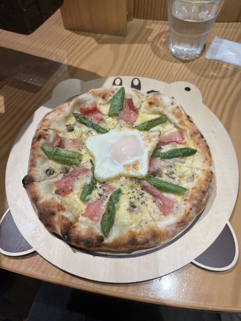 Kirby Cafe Hakata Kirby Cafe Real Oven Baked Pizza Creamy Carbonara with a star shaped egg