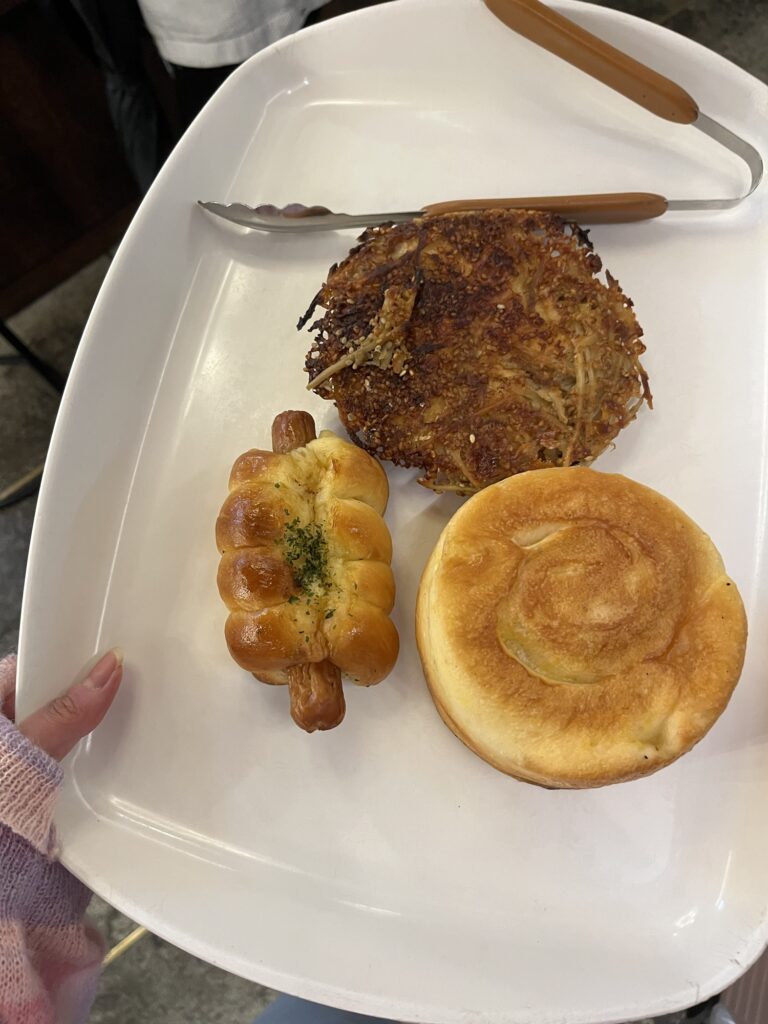 Saint Germain Milk Roll, Burdock Root Sesame Bread, and Sausage Bread
